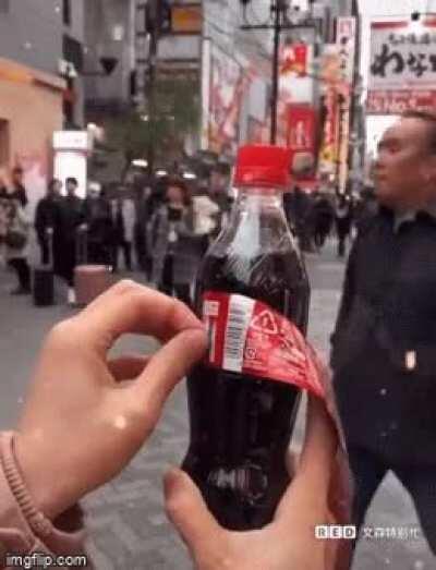 Japanese holiday edition Coca Cola bottle turns into a ribbon