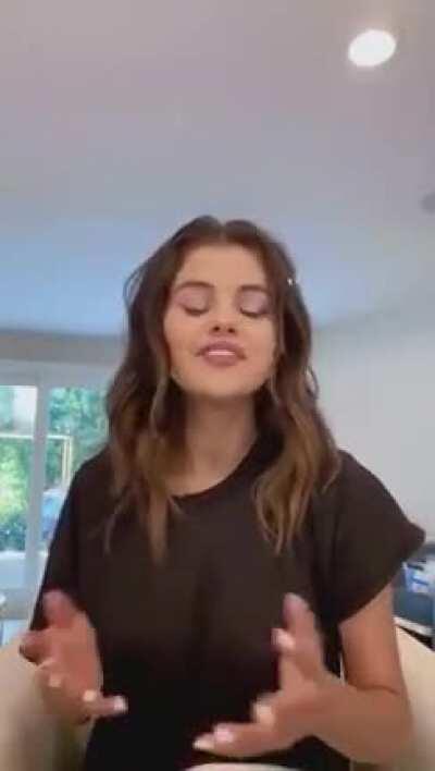 Sel in a black shirt