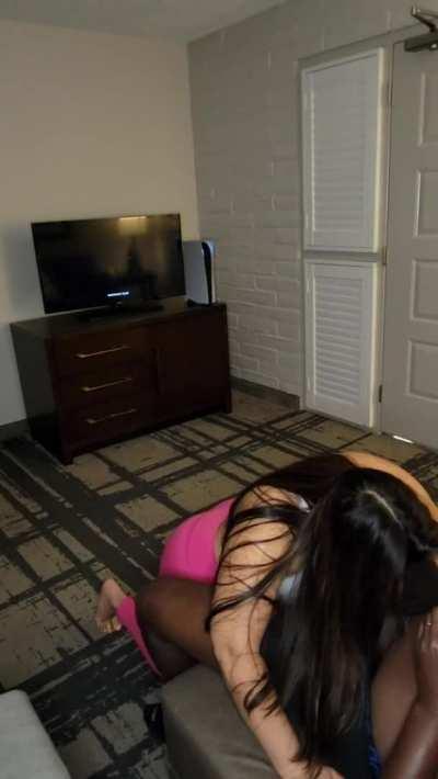 Sucking his wand while he plays Hogwarts Legacy.