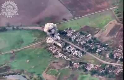 Drone footage of a Ukrainian fighter jet, using a precision-guided bomb, attacking a Russian command post in one of the buildings and at the same time seeming to have hit an ammunition depot.