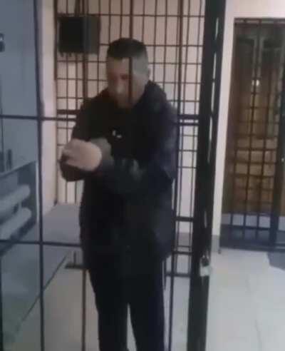 Drunk Russian in a cage