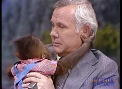 Johnny Carson hugging a baby orangutan, 1978.