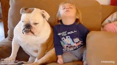 Nap time for the dog and his tiny human.