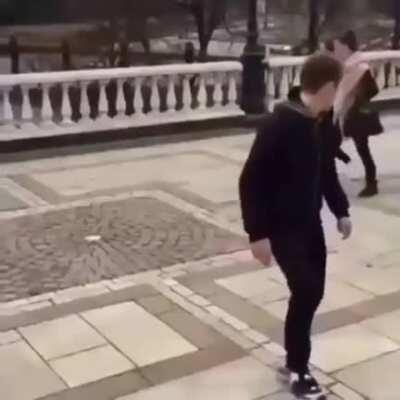 Trying to impress a girl, but instead he got nutmeg.