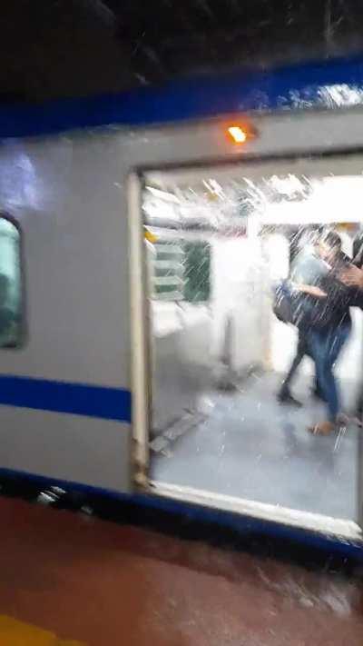 People had to use umbrella to get out of the train at Kalyan station