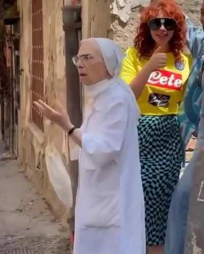 Nun pulls apart girls kissing during photo shoot in Naples