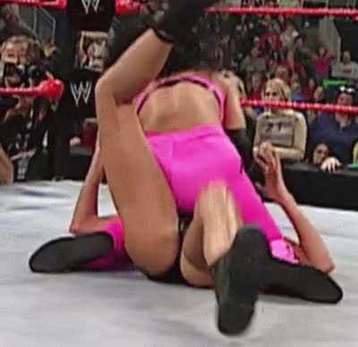 Stacy kicks vigorously as shes pummeled by Victoria