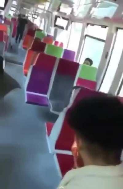 Playing with firecrackers inside a busy train