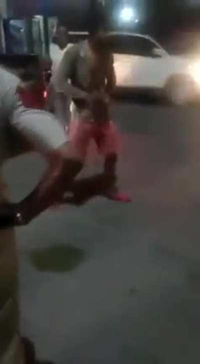 Cop shoots a guy in India.