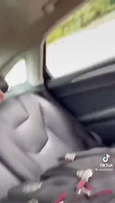 Uber driver freaks out and throw passenger's luggage on the road.