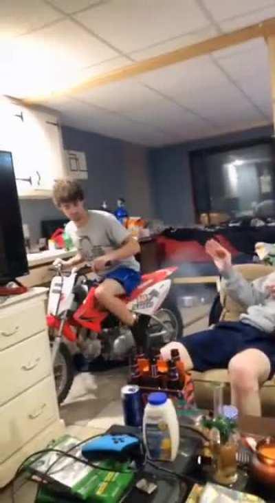 Why is there a dirt bike in the kitchen? I mean living room. I mean bedroom.