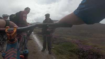 Mountain Bikers randomly bump into King Charles on a solitary walk.