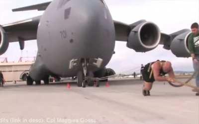 Absolute unit pulls an absolute unit of a plane weighing 189 TONS