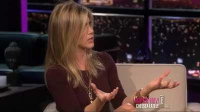 Jennifer Anniston in heels, talking about kicking a guy in the balls for a TV advert.