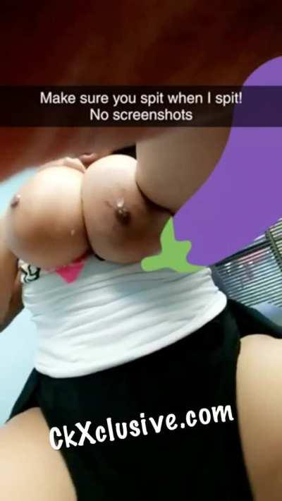 Spitting on her tits