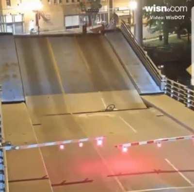 Idiot cyclist ignores blockade