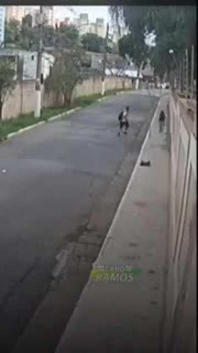 Motorcycle gunmen get hit by a car.