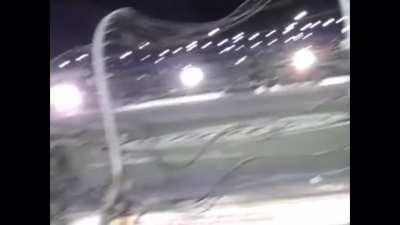 Racing car goes flying into the fence