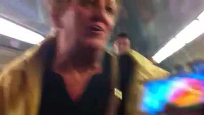 Racist lady on train calls police on kid for not giving her their seat even though there are other seats (sorry for the bad quality)