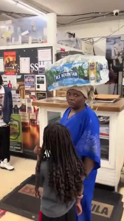 “I think it’s cool” Lady carrying bottled water “African style” goes from 0 to 160 on the guy filming..