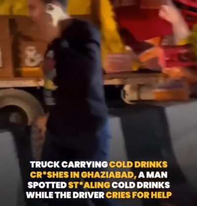 Truck carrying cold drink crashes in Ghaziabad, a man spotted stealing while the driver cries for help