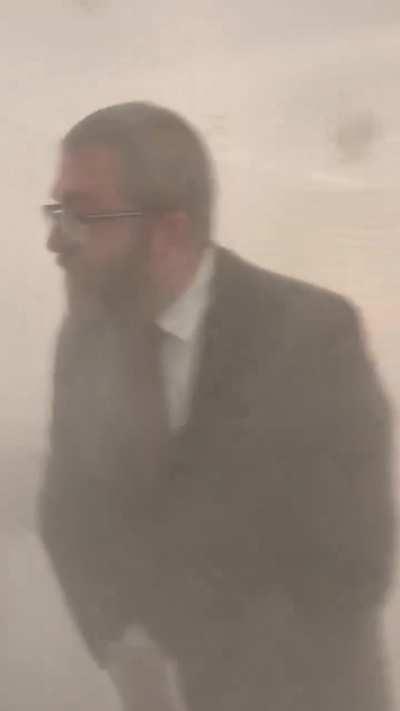 A Polish depute Grzegorz Braun extinguishes the Jewish menorah on Hanukkah inside the Polish Parliament 12.12.2023