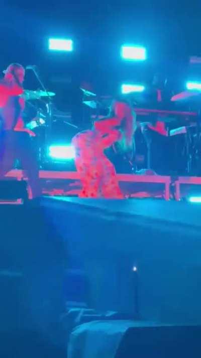 Camila doing her thing to the dancer