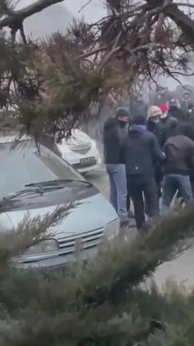 Protesters are handed out weapons