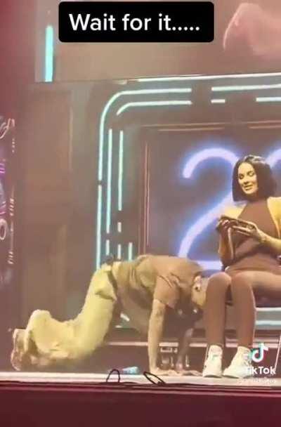 Chris Brown brought a fan on stage and she stayed on her phone… so he tossed it in the crowd