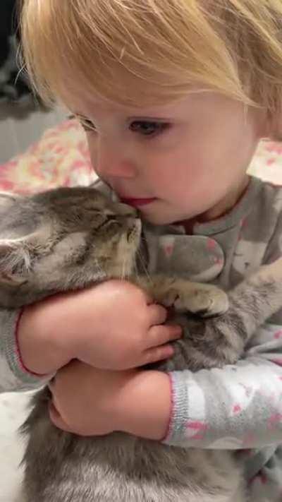 Not sure why my original post got removed. (Volume up) Luna and her tiny human. Found in a tree and after no one came forward…she became ours. I should say my daughters. Promise my daughter is being gentle. I’d never let her hold her long or if I wasn’t n