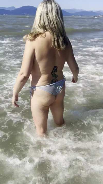 Just a cumslut bimbo trophywife slut at the beach… topless