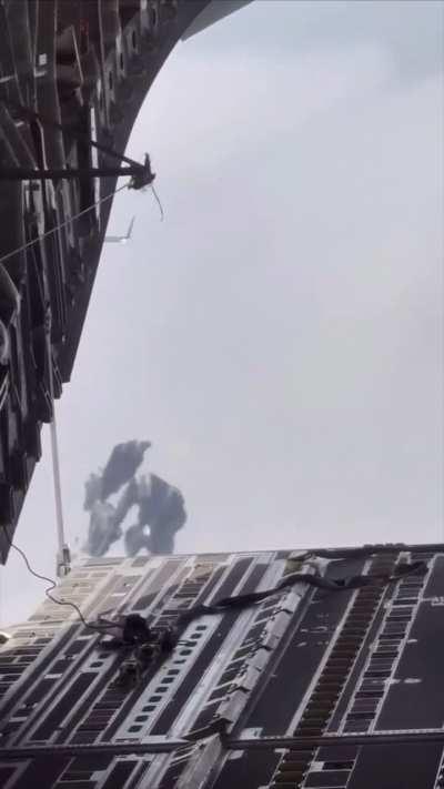 Is this safe? With all the cargo debris flying towards the plane behind (2x UAE Air Force dropping humanitarian aid over Gaza)