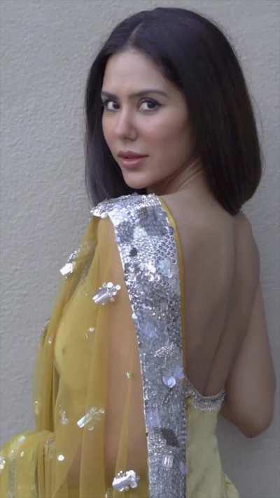 Sonam Bajwa Part 2 :- Now She let your vision fall on her Creamy Back and give view of her Busty Breasts.