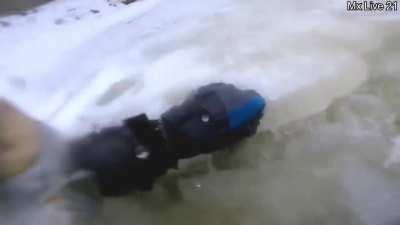 Motorcyclist break through the ice of a river