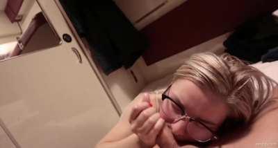 Blonde with glasses jerks him off into her mouth