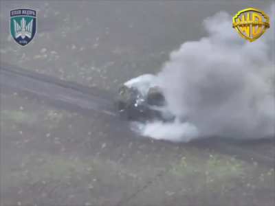 The gun of the Russian BTR-82 starts firing after the vehicle was hit by a Ukrainian FPV quad.