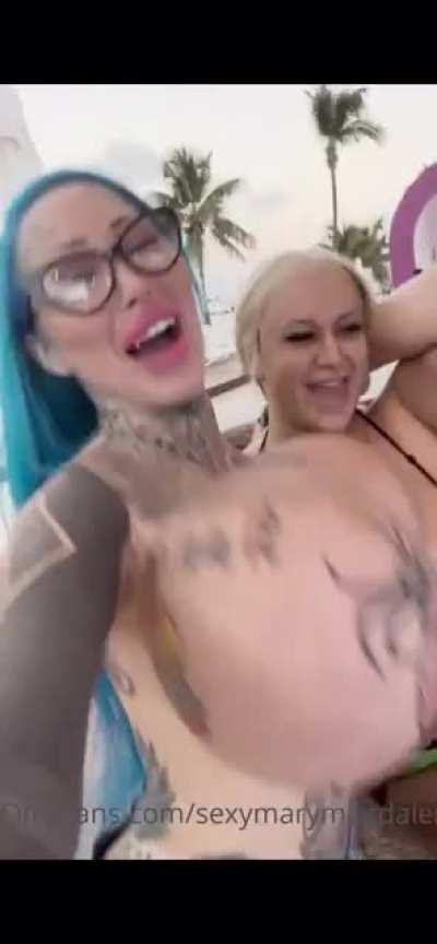 Xomarym at a bar, topless