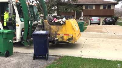 Who films the garbage truck?