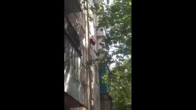 Man falls off a building after pretending to be Spiderman.