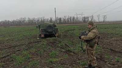 Ukrainian soldier using an improvised MLRS made from B-8 launchers for 80-mm aircraft missiles and installed on the HMMWV. 2022