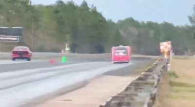 Drag car decides to fly down the track. Driver walked away.