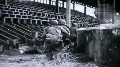 U.S. Army soldiers and tanks fights Japanese troops inside the Rizal Memorial Baseball Stadium in city of Manila, Philippines (February 1945)
