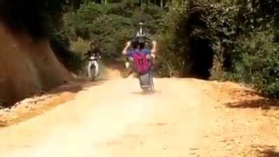 WCGW...doing a wheelie on a bike??