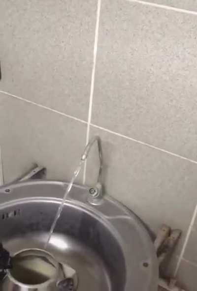 In Soviet Russia, electricity switch turns on water.