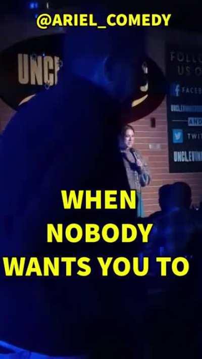 Obnoxious Heckler throws their beer at a comedian on stage.