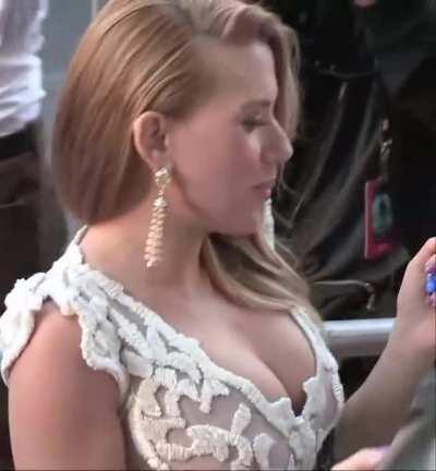 Scarlett Johansson's tits almost pulling out of her dress