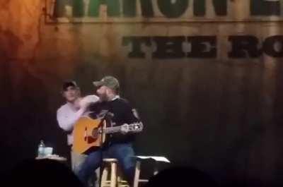 WCGW walking on stage to try and hug someone performing