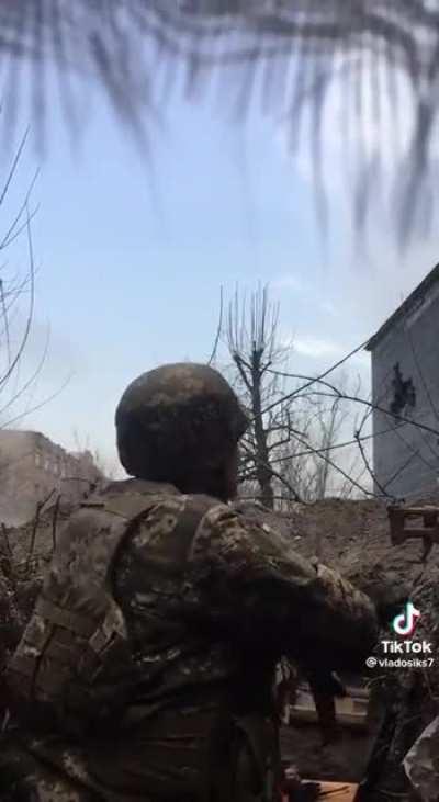 Ukrainian soldiers under shelling and fire in a trench. Unknown location/date.