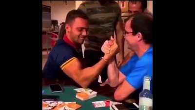 Trying to arm wrestle.