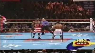 Lennox Lewis sees an opening and knocks Hasim Rahman out